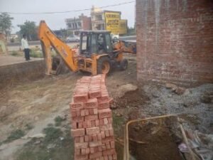 अयोध्या25मई24*खलिहान की भूमि से बुलडोजर से हटवाया गया कब्जा